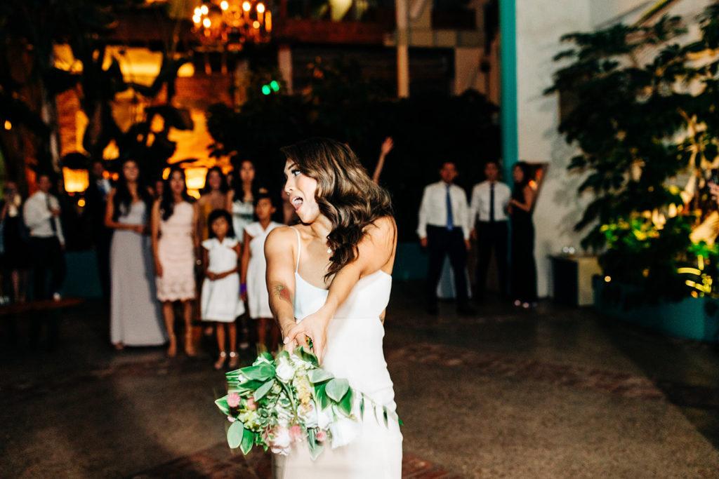 bride doing the bouquet toss at her wedding at valentine dtla