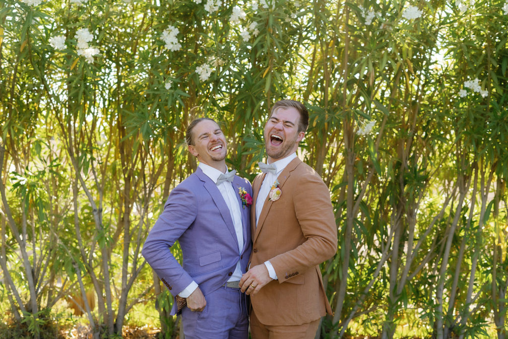 lgbtq photographer in san diego; two men laugh together on their wedding day