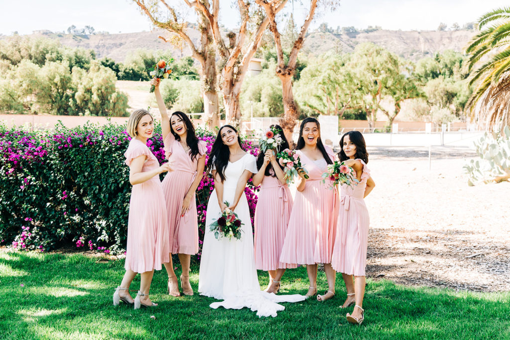 Camarillo wedding photography ; bridal party poses with bouquets