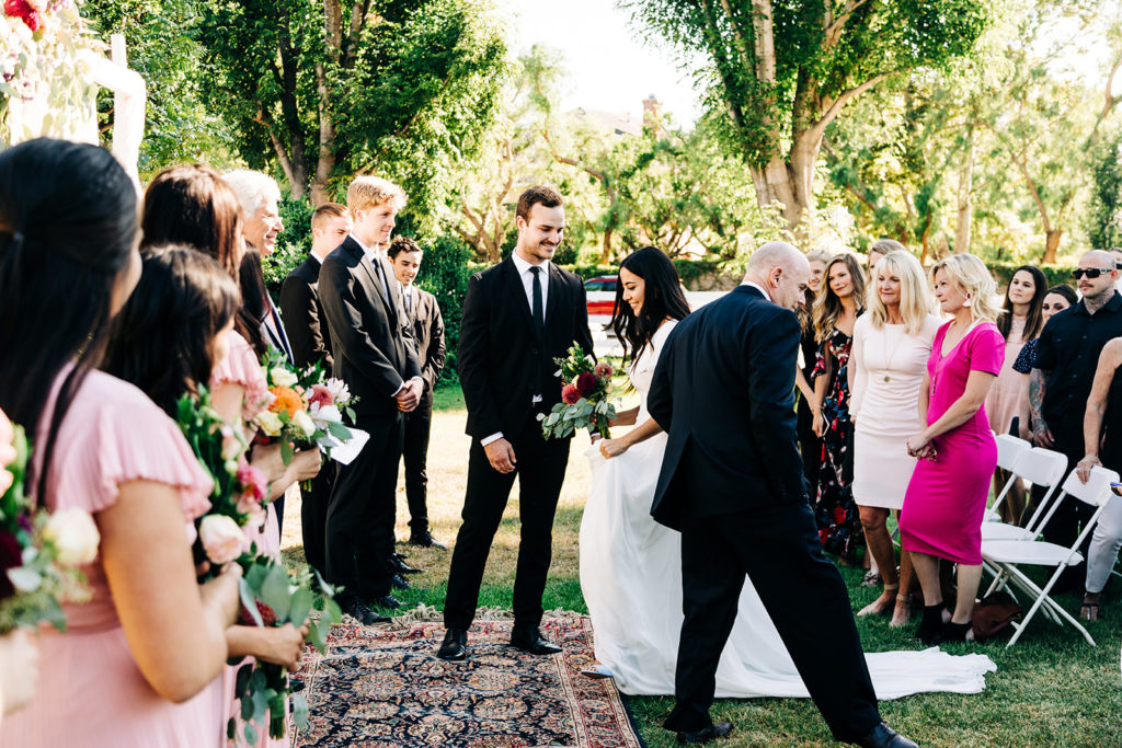 Camarillo wedding photography ; bride approaches groom during wedding ceremony