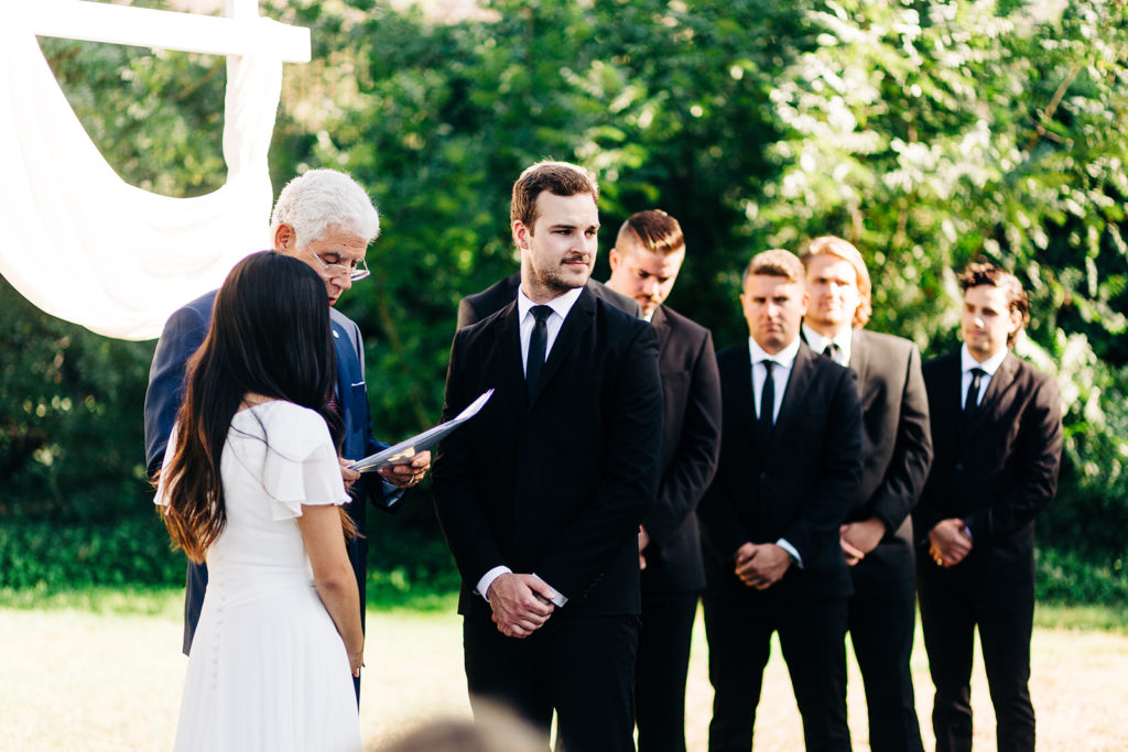 Camarillo wedding photography ; groom and groomsmen stand at ceremony