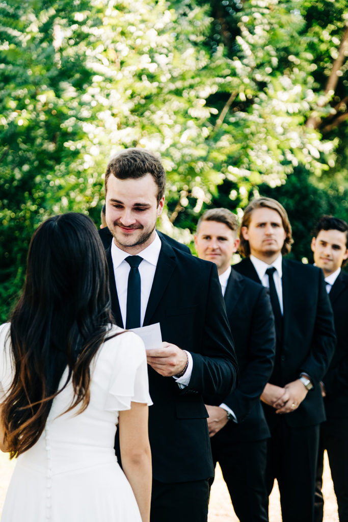 Camarillo wedding photography ; groom smiling during vows on wedding day
