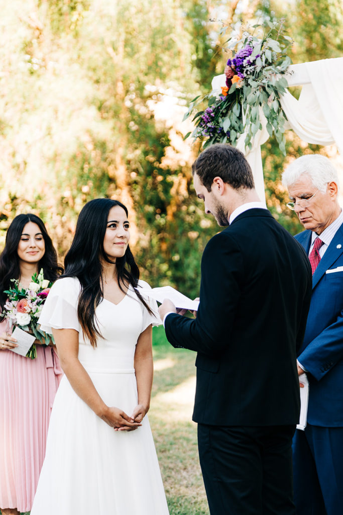 Camarillo wedding photography ; groom reading vows on wedding day