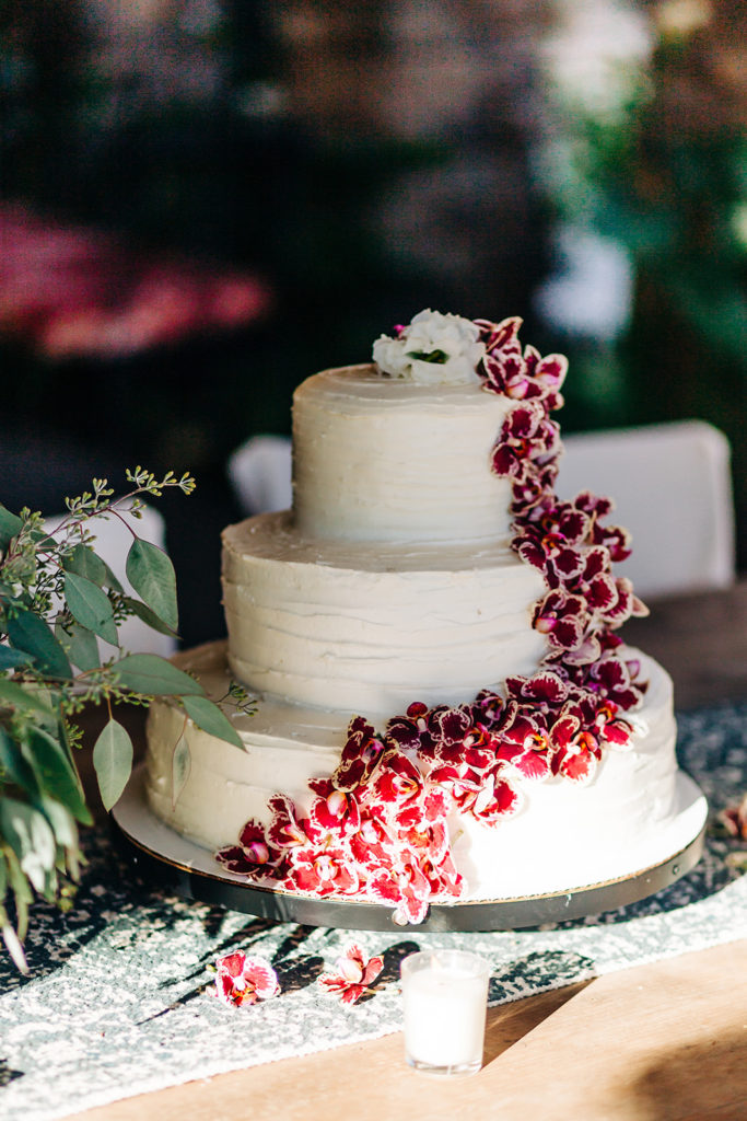 Camarillo wedding photography ; wedding cake covered in red flowers