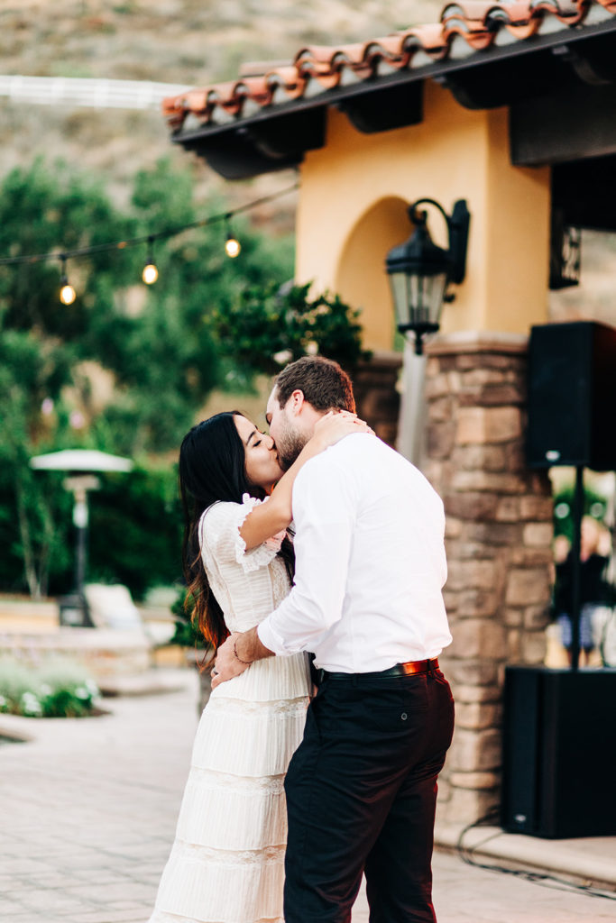 Camarillo wedding photography ; bride and groom kiss at wedding reception