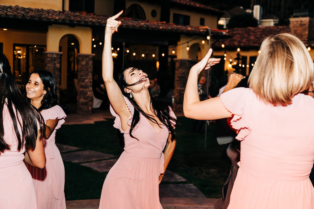 Camarillo wedding photography ; bridesmaids dancing at night after wedding
