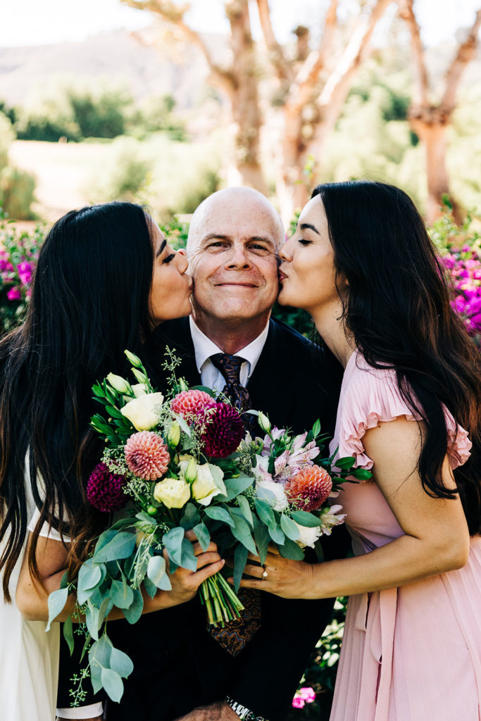 Camarillo wedding photography ; bride and bridesmaid kiss the father