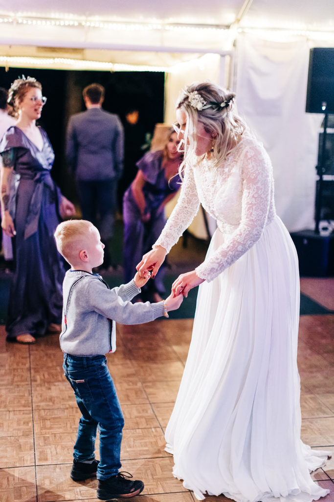 Redfish Lake Lodge wedding photography ; bride dancing wth little boy