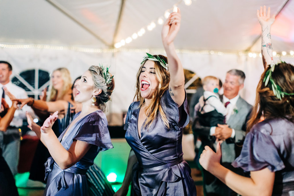 Redfish Lake Lodge wedding photography ; bridesmaid dancing and singing