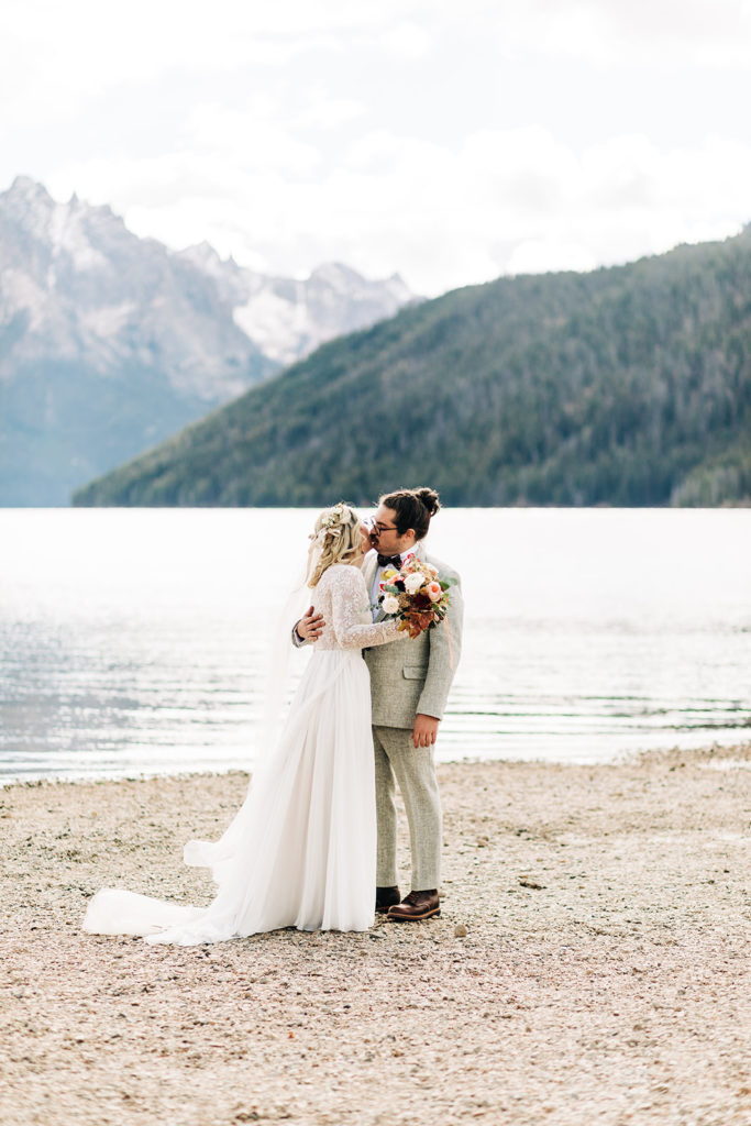 Redfish Lake Lodge wedding photography ; bride and groom first look on a lake