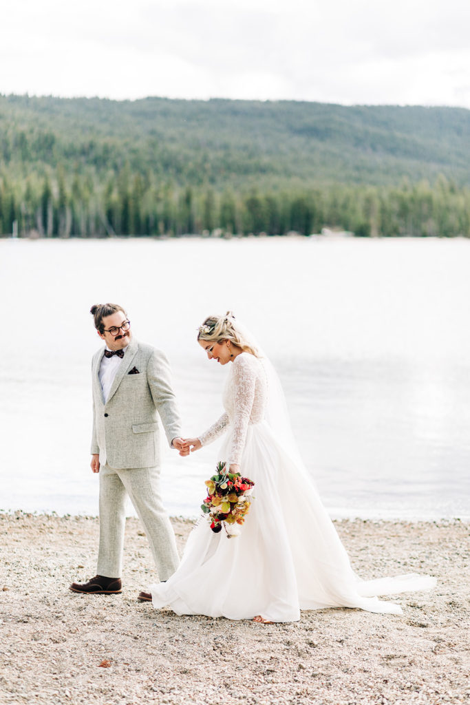 Redfish Lake Lodge wedding photography ; bride and groom candid shot on a lake