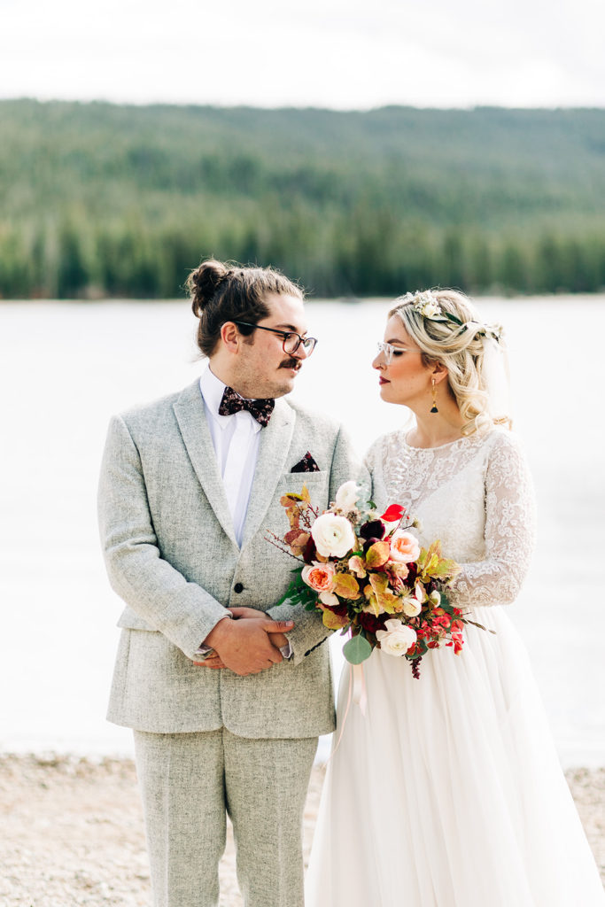 Redfish Lake Lodge wedding photography ; bride and groom look at each other