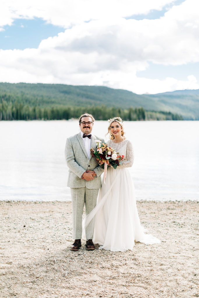 Redfish Lake Lodge wedding photography ; bride and groom stand side by side