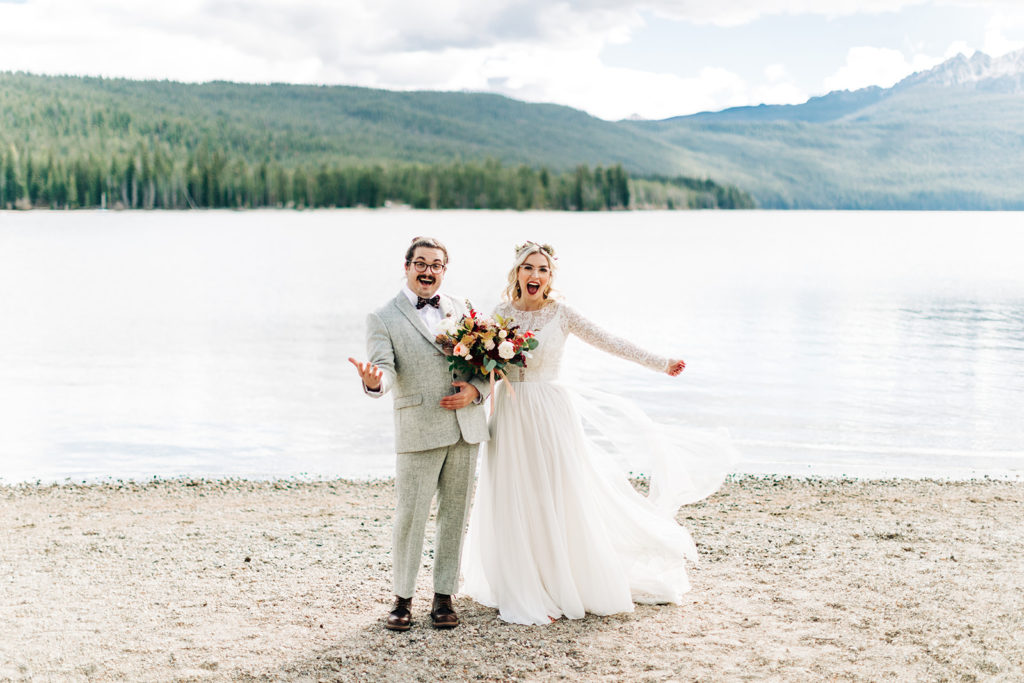 Redfish Lake Lodge wedding photography ; bride and groom laugh for camera
