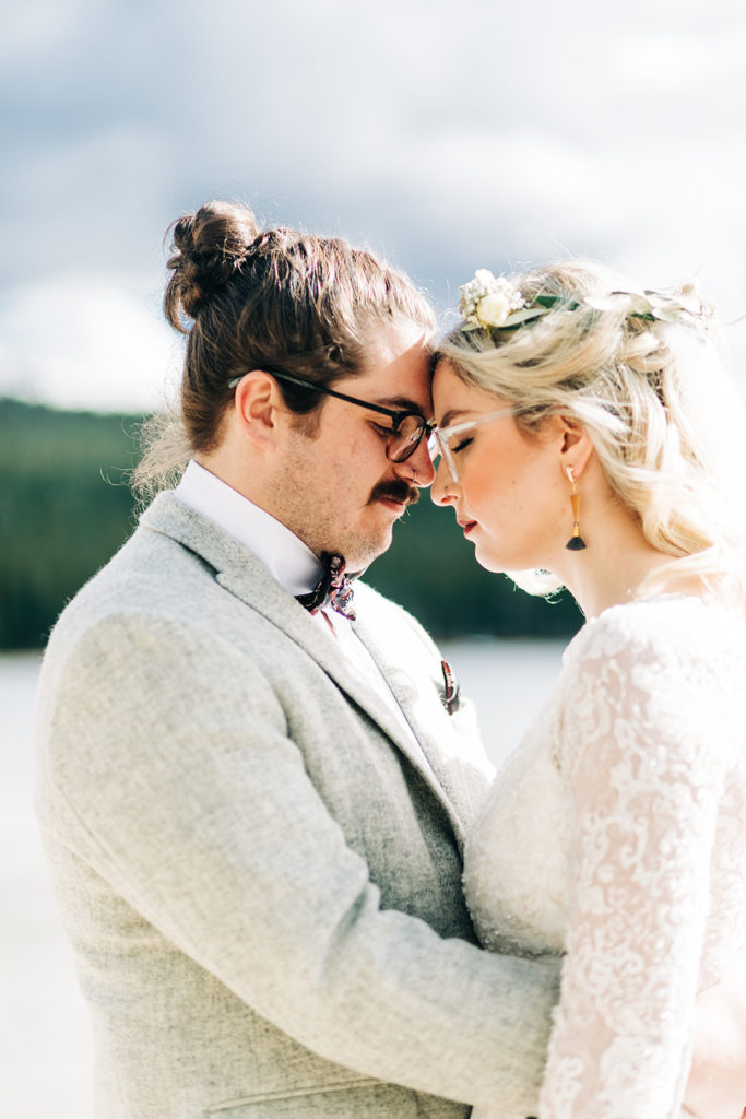 Redfish Lake Lodge wedding photography ; bride and groom face each other