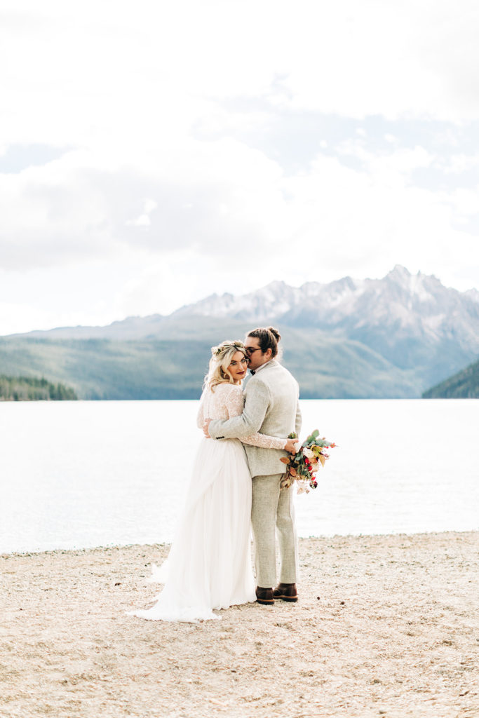 Redfish Lake Lodge wedding photography ; bride and groom embrace during first look
