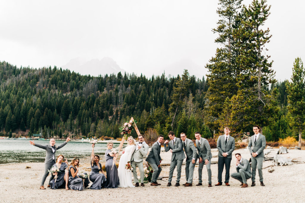 Redfish Lake Lodge wedding photography ; candid wedding party laughing on the sand