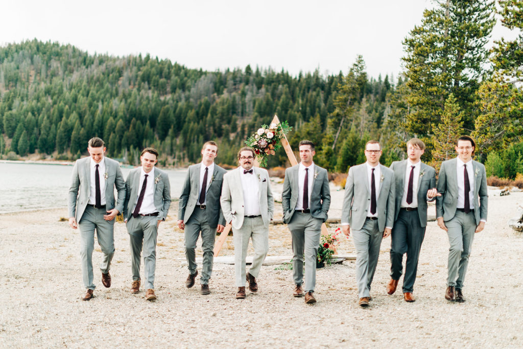 Redfish Lake Lodge wedding photography ; groomsmen walk toward camera