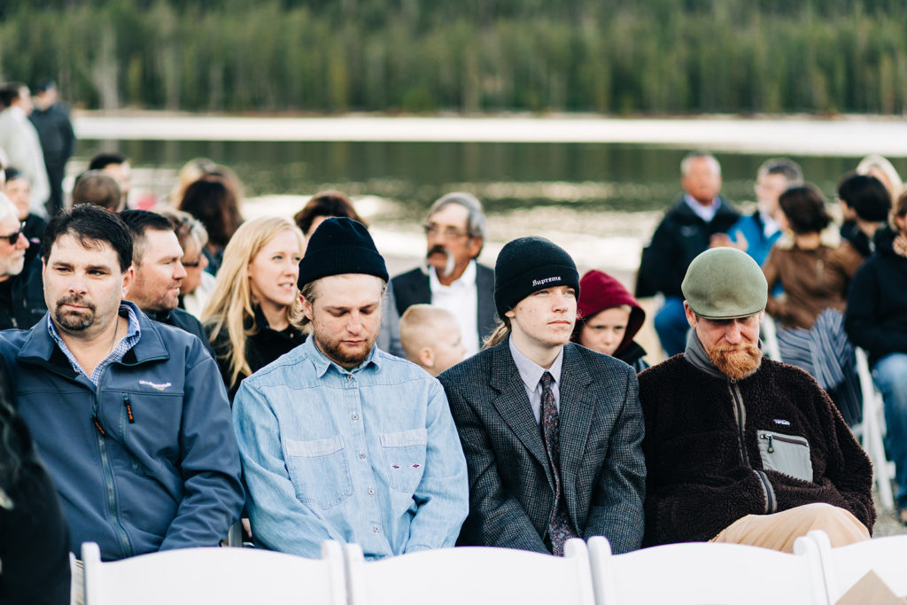 Redfish Lake Lodge wedding photography ; guests sit waiting for the ceremony