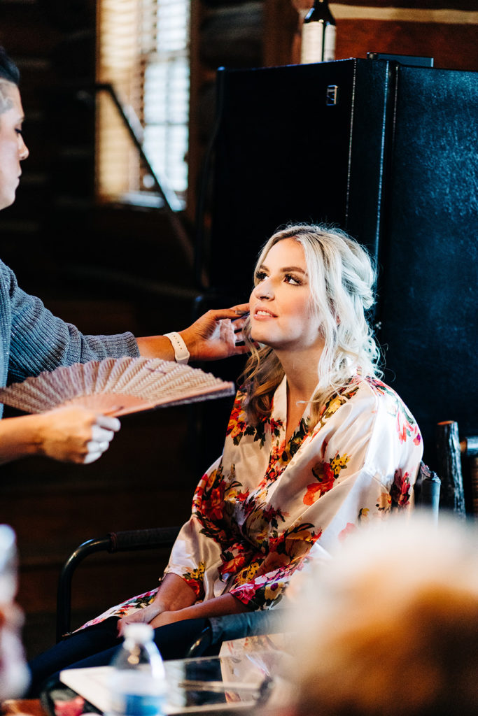 Redfish Lake Lodge wedding photography ; bride getting her makeup done before wedding