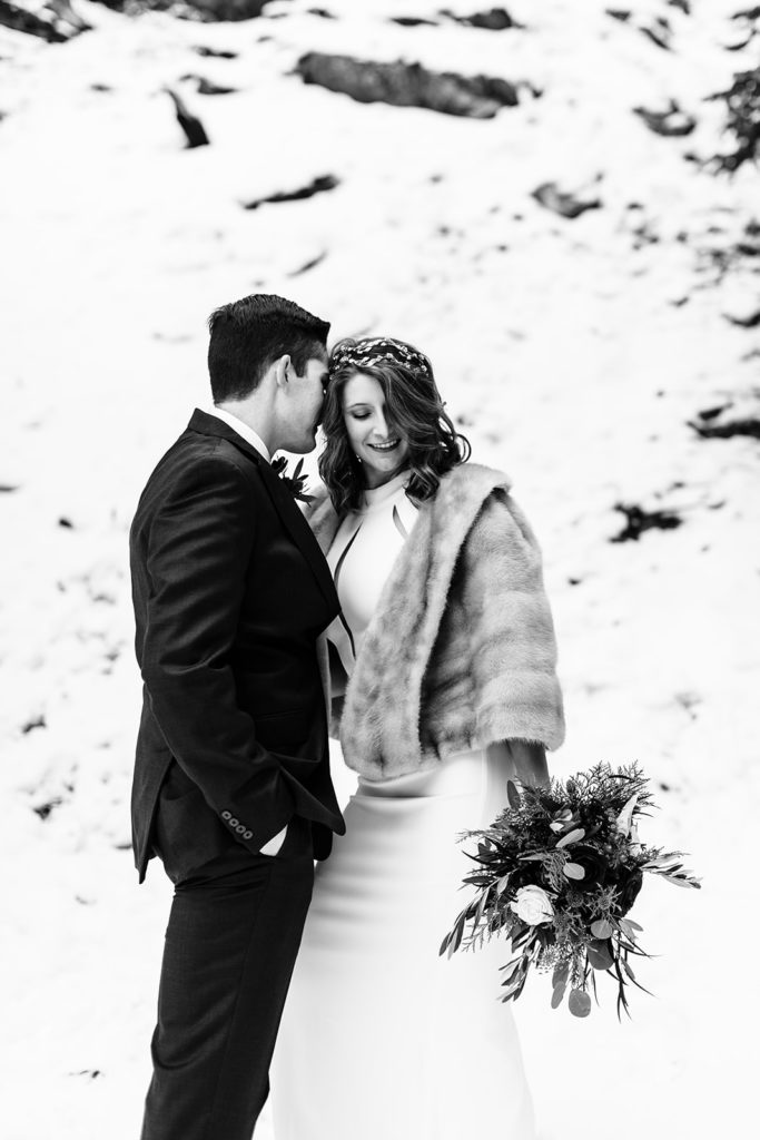 Mt. Baldy wedding photography ; black and white bride and groom pose in the snow