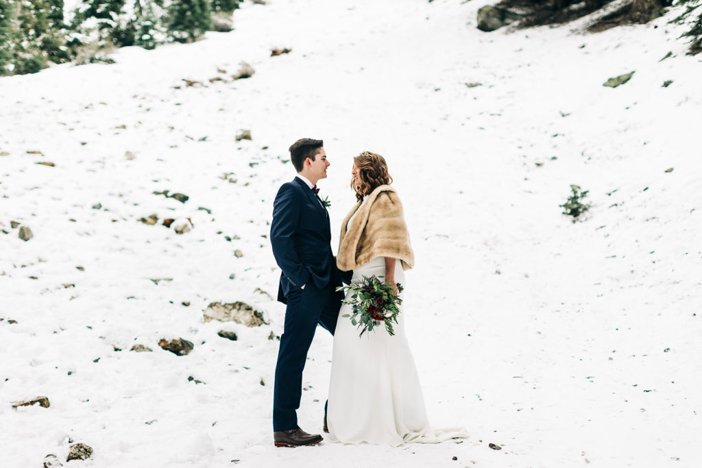 Mt. Baldy wedding photography ; bride and groom on a snowy hill