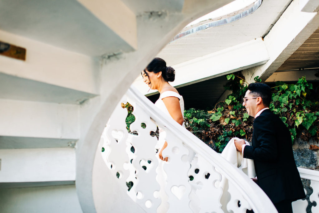 The Madonna Inn In San Luis Obispo, CA wedding photography; bride going upstairs