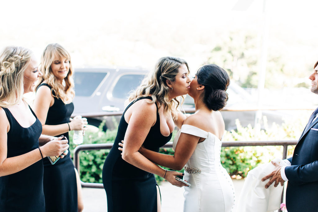 The Madonna Inn In San Luis Obispo, CA wedding photography; bride greeting the bridesmaids