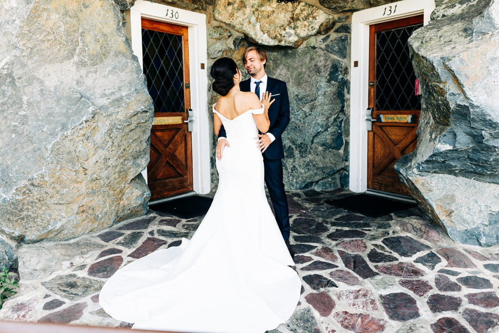 The Madonna Inn In San Luis Obispo, CA wedding photography; bride and groom standing in front of the door