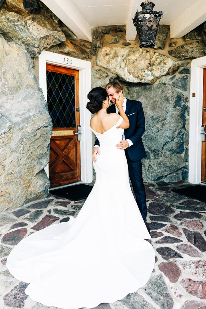 The Madonna Inn In San Luis Obispo, CA wedding photography; bride and groom standing in front of the door