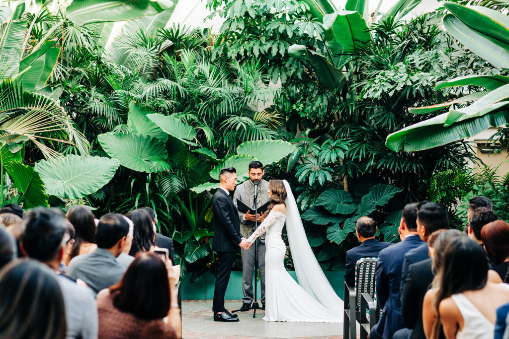 Valentine DTLA Wedding, Los Angeles wedding photographer; bride and groom holding hands at the altar