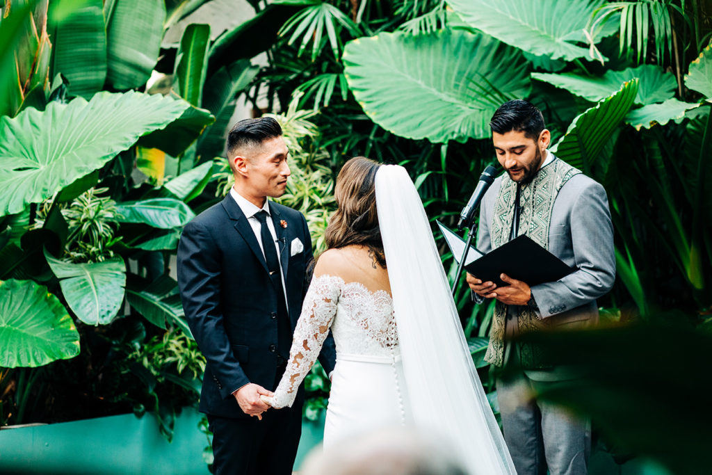 Valentine DTLA Wedding, Los Angeles wedding photographer; bride and groom listening to the officiant