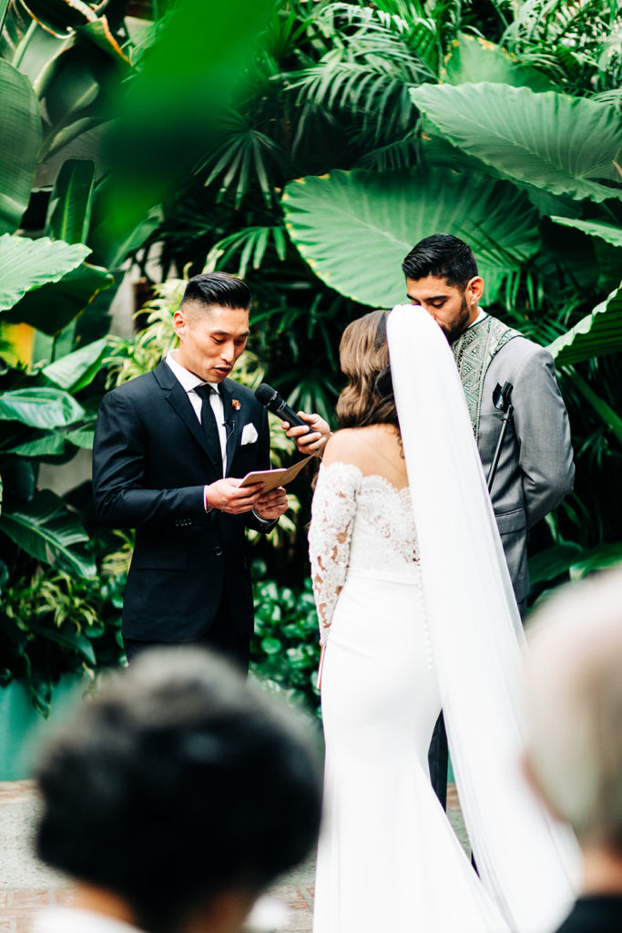 Valentine DTLA Wedding, Los Angeles wedding photographer; groom reading his vows to his bride