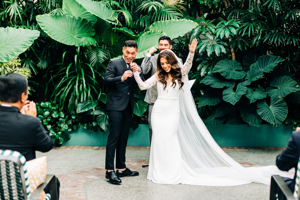 Valentine DTLA Wedding, Los Angeles wedding photographer; bride and groom walking down the aisle and celebrating