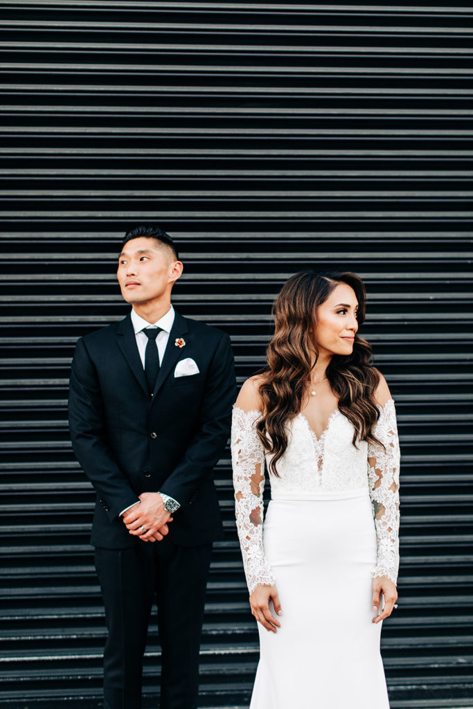 Valentine DTLA Wedding, Los Angeles wedding photographer; bride and groom looking opposite directions in their wedding attire