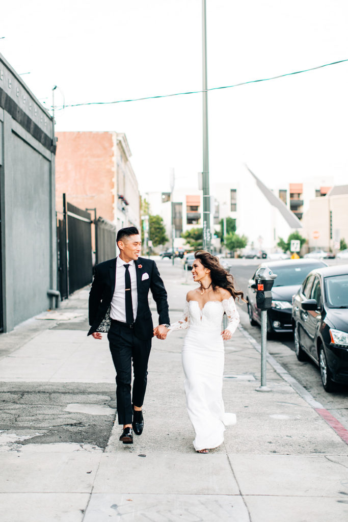 Valentine DTLA Wedding, Los Angeles wedding photographer; bride and groom running towards the camera