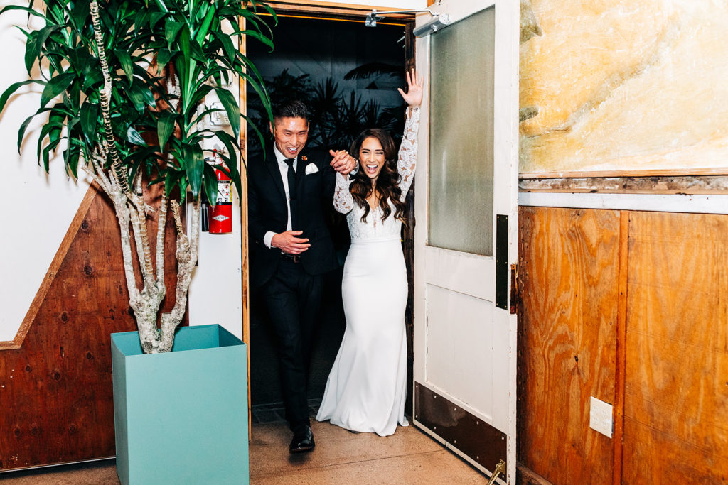 Valentine DTLA Wedding, Los Angeles wedding photographer; bride and groom entering the reception for the firs time as husband and wife