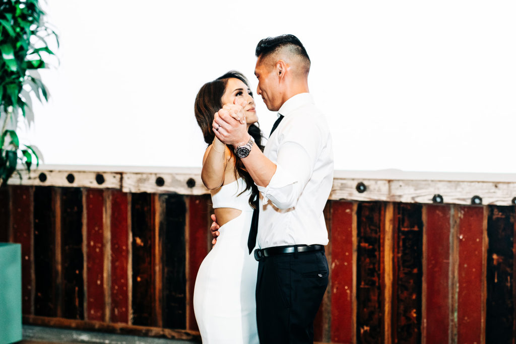Valentine DTLA Wedding, Los Angeles wedding photographer; bride and groom dancing together