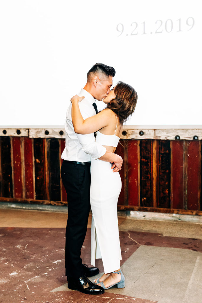 Valentine DTLA Wedding, Los Angeles wedding photographer; bride and groom kissing while they dance together