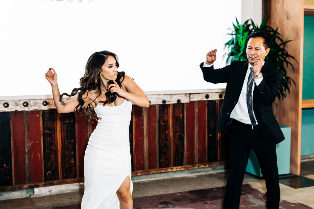 Valentine DTLA Wedding, Los Angeles wedding photographer; bride and her father dancing to an upbeat song at her wedding
