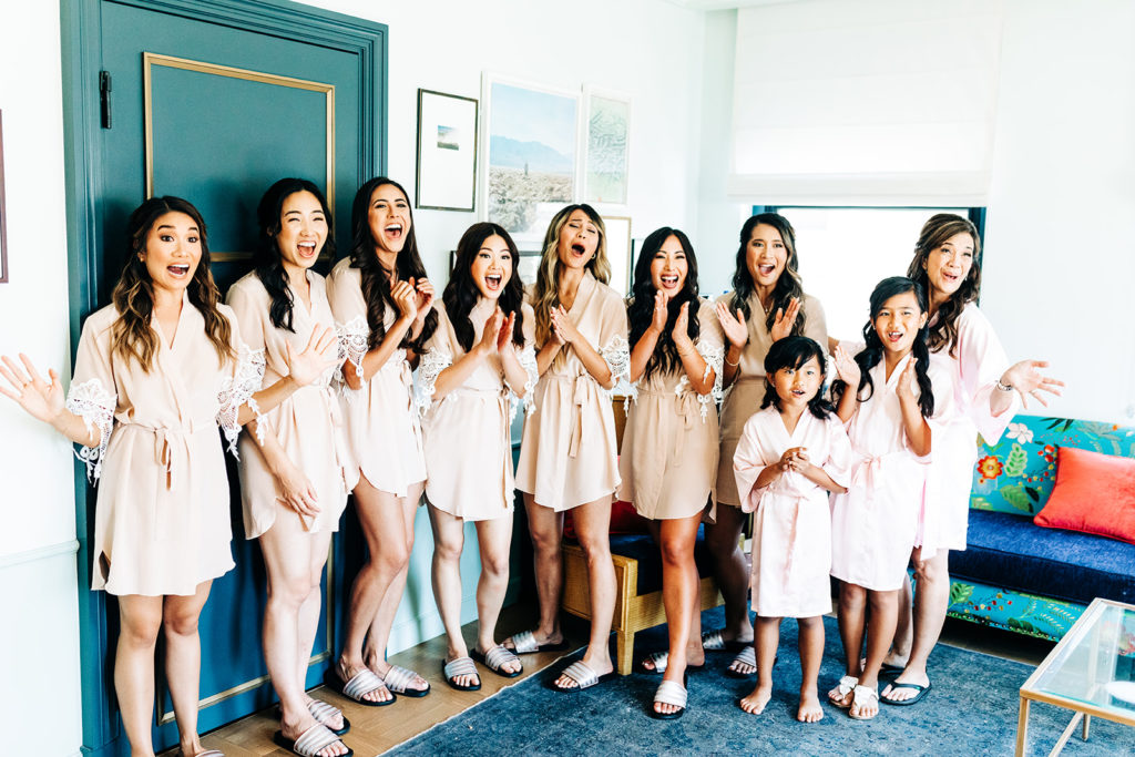 Valentine DTLA Wedding, Los Angeles wedding photographer; bridal party excitedly yelling as the bride walks in the room in her wedding dress