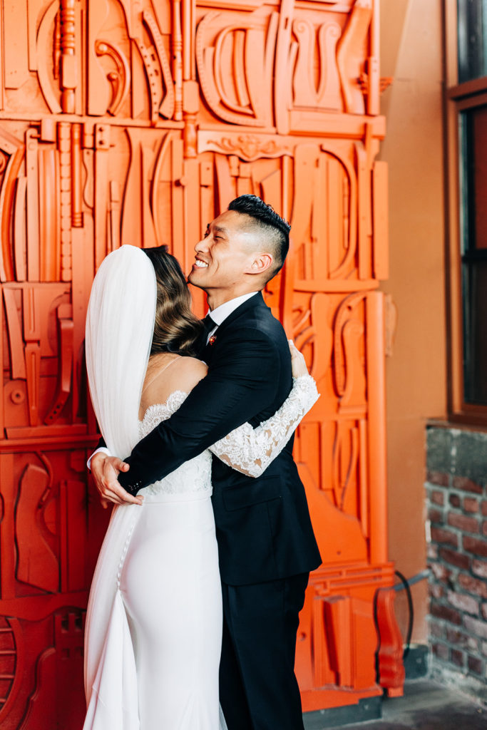 Valentine DTLA Wedding, Los Angeles wedding photographer; bride and groom hugging