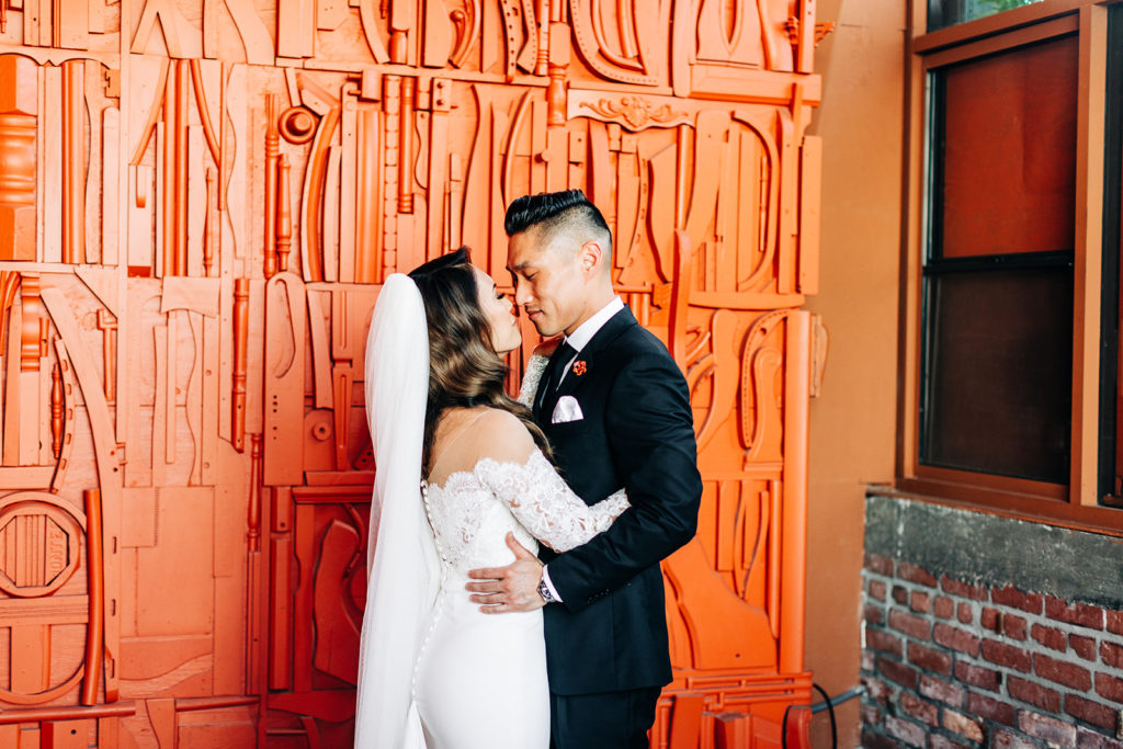 Valentine DTLA Wedding, Los Angeles wedding photographer; bride and groom holding each other close