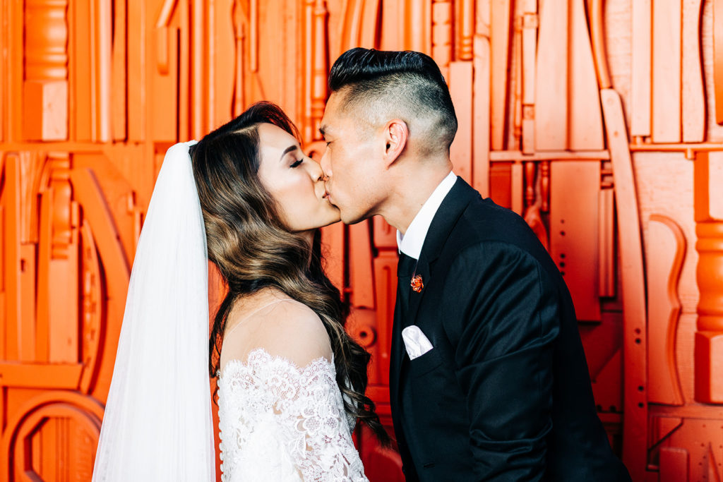 Valentine DTLA Wedding, Los Angeles wedding photographer; bride and groom kissing in their wedding attire