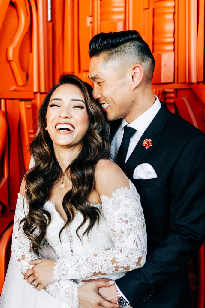 Valentine DTLA Wedding, Los Angeles wedding photographer; bride and groom holding each other close and laughing