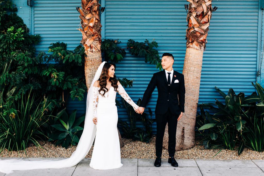 Valentine DTLA Wedding, Los Angeles wedding photographer; bride and groom holding hands and looking at each other