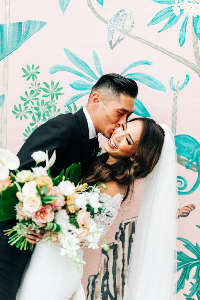 Valentine DTLA Wedding, Los Angeles wedding photographer; groom kissing the brides cheek