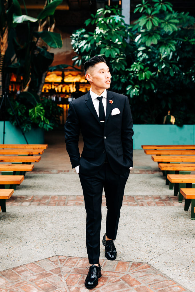 Valentine DTLA Wedding, Los Angeles wedding photographer; groom walking in his suit