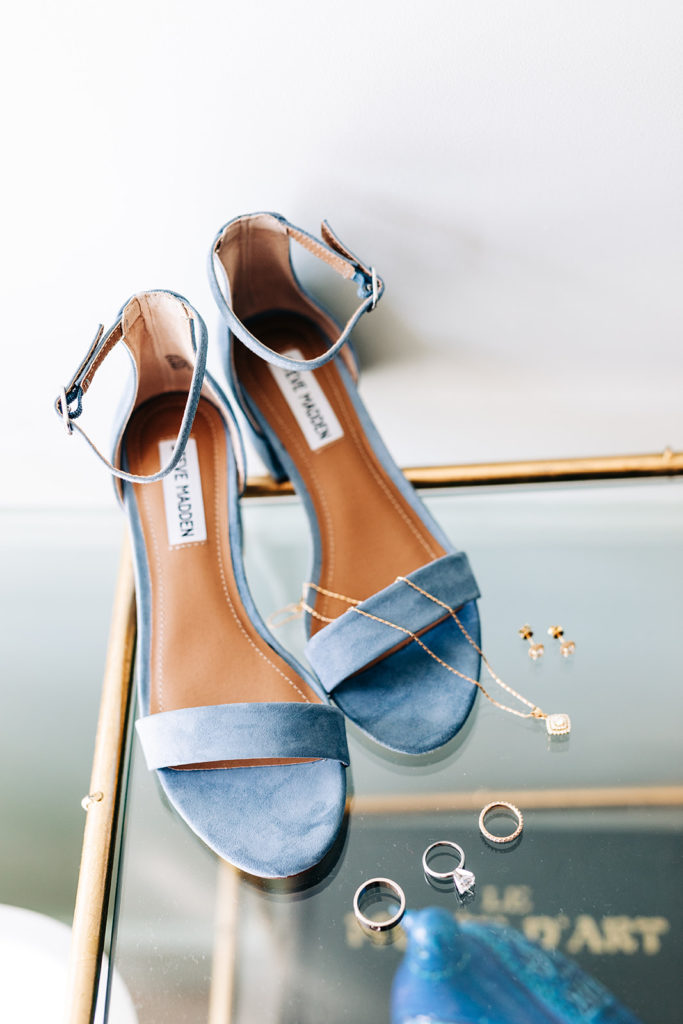 Valentine DTLA Wedding, Los Angeles wedding photographer; blue suede steve madden shoes surrounded by jewelry
