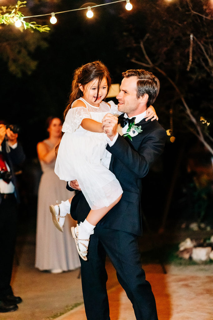 The Gold Mountain Manor In Big Bear, CA wedding photography; groom dancing with little girl